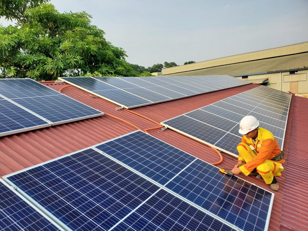 The Art of Drawing Readers In: Your attractive post title goes here A solar technician performs maintenance on rooftop solar panels enhancing energy efficiency.